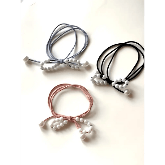 Pochette cadeau trois élastiques cheveux noire, rose et bleu