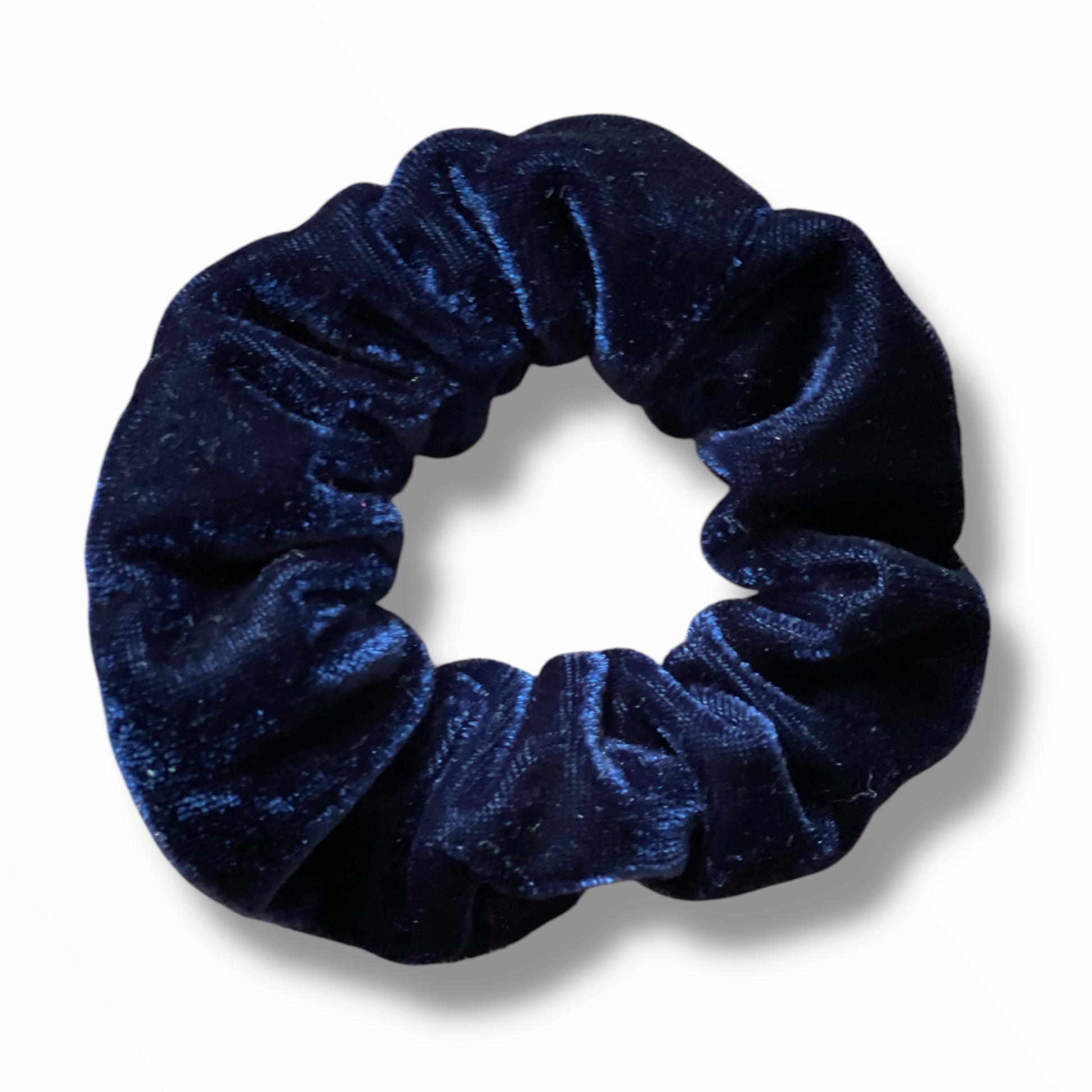 Chouchou velours bleu marine élégant pour cheveux.